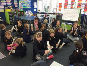 1 students learning rakau actions to E Papa